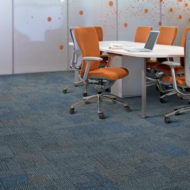 Interface Pathways II carpet tile in office with orange desk chair image number 1
