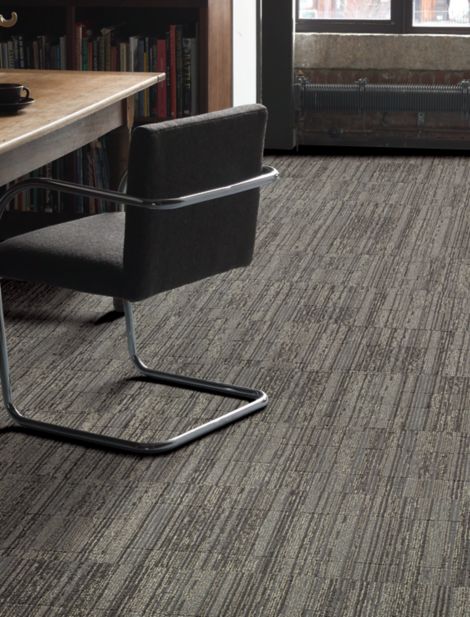 Interface Permian carept tile in private office area with desk and chair