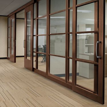 Interface Micro Line and Pin Line carpet tile in office corridor with wooden and glass sliding doors  imagen número 1