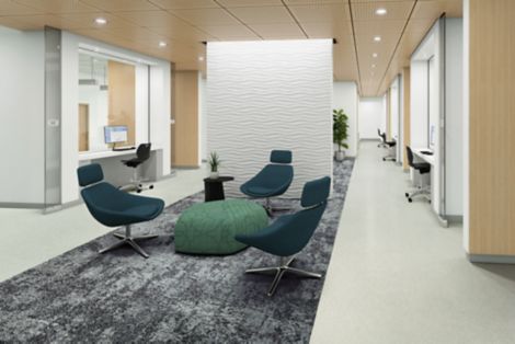 Interface Plant-astic LVT and Just Deserts plank carpet tile in waiting area with plants and dividing wall