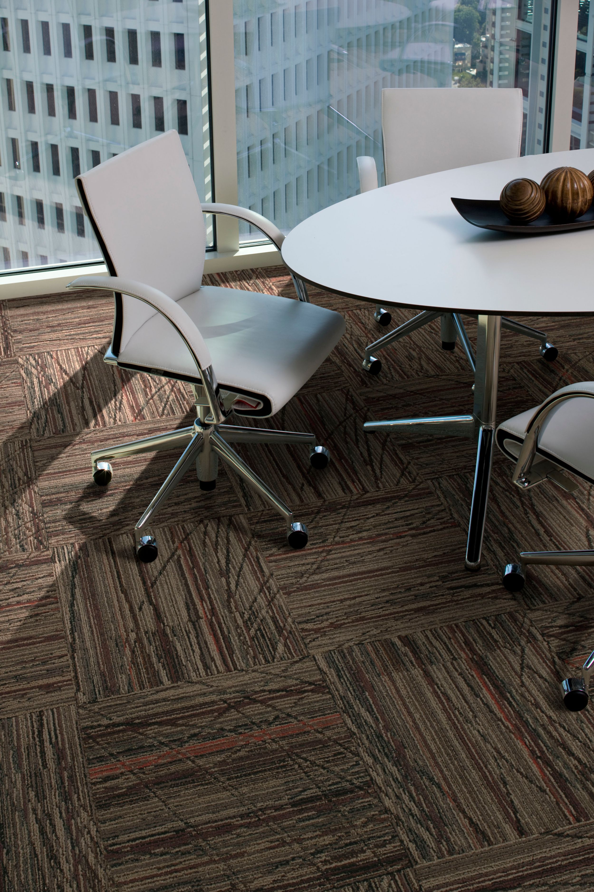 Detail of Interface Prairie Grass carpet tile in private office with table and chairs image number 7