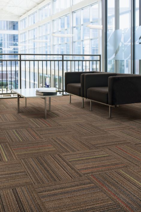 Interface Sew Straight and Primary Stitch carpet tile in seating area with two chairs and table