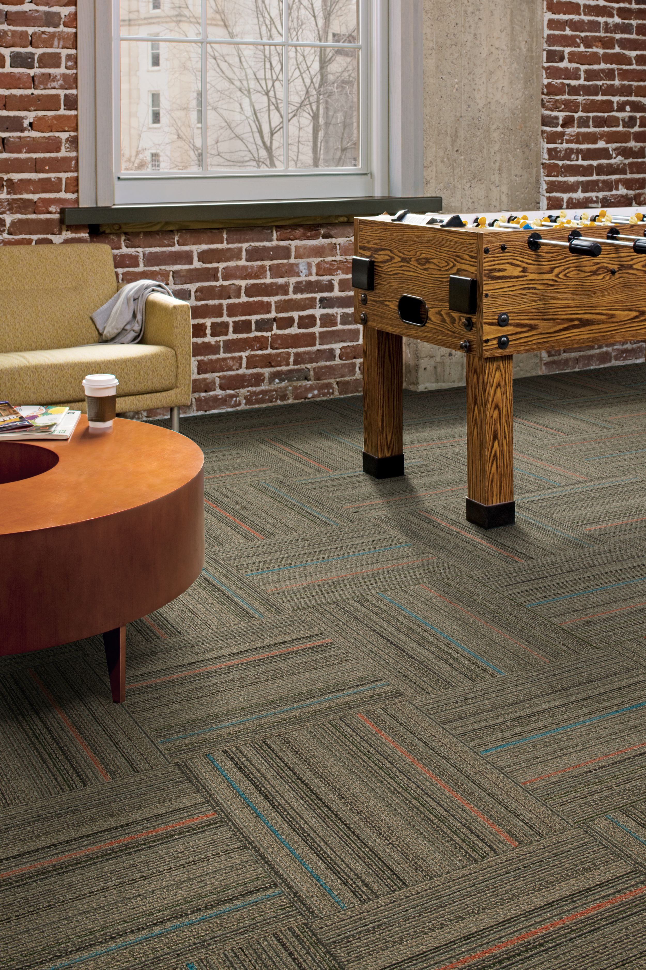 Interface Primary Stitch carpet tile in lounge area with foosball table image number 1