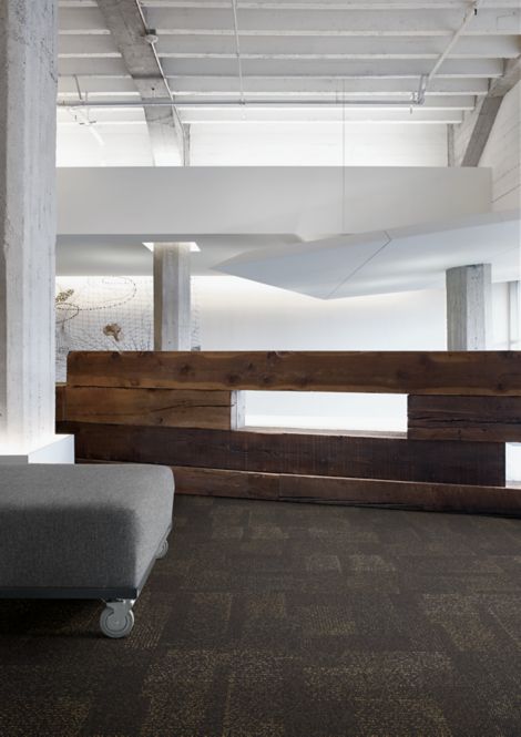 Interface Profile carpet tile in reception area with short wood wall
