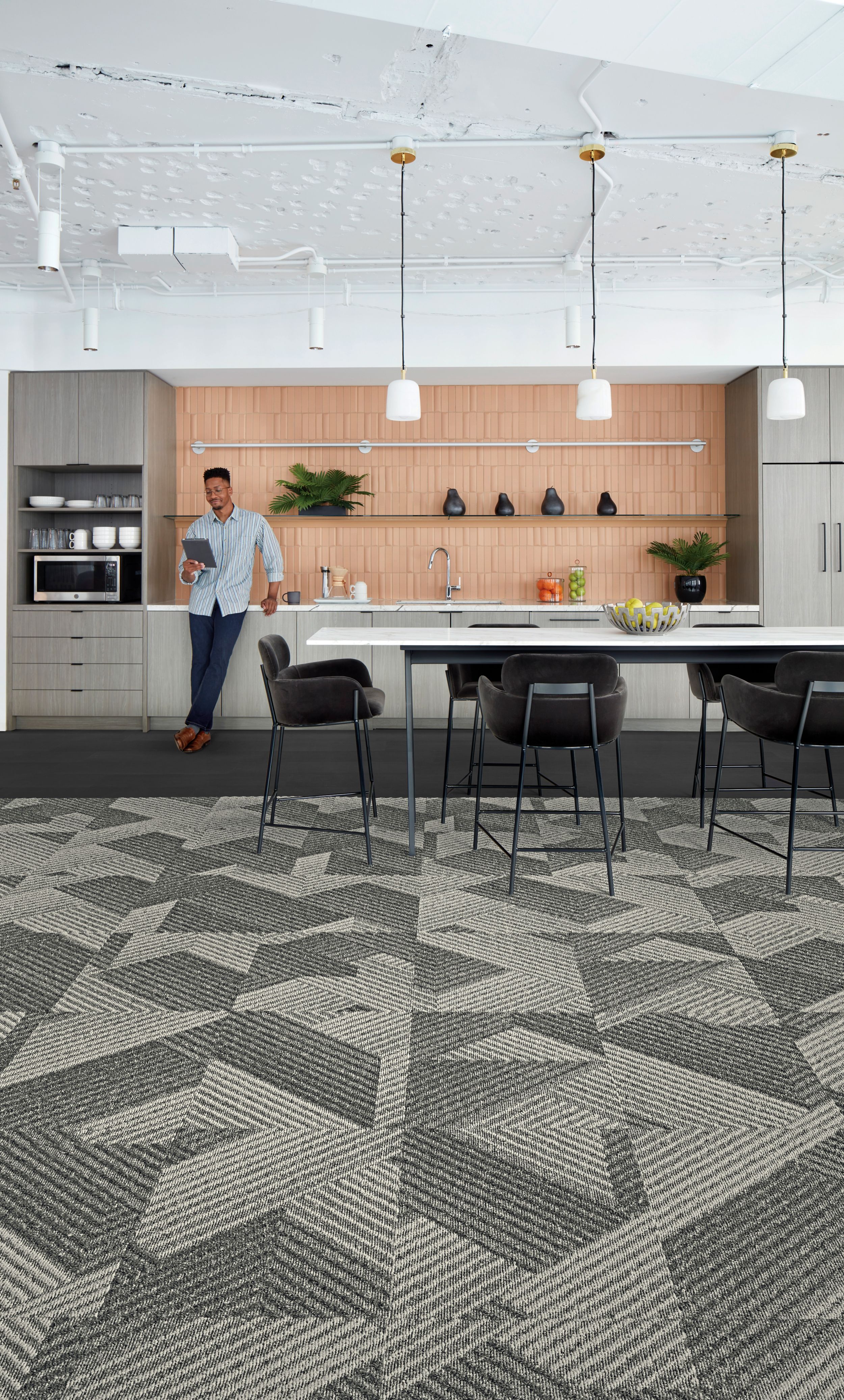 Interface Proportional carpet tile and Brushed Lines LVT in kitchen area with man on tablet image number 2