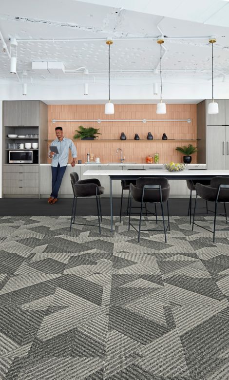 Interface Proportional carpet tile and Brushed Lines LVT in kitchen area with man on tablet