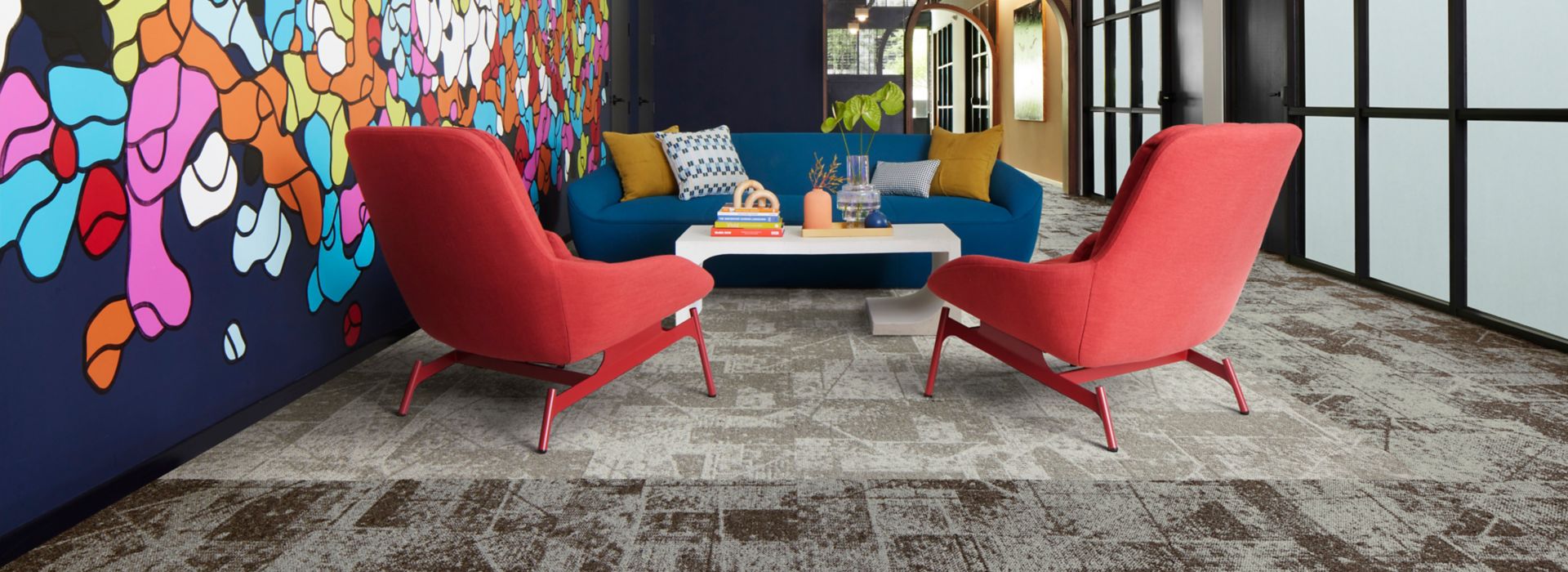 Interface Prototype carpet tile in seating area with colorful mural