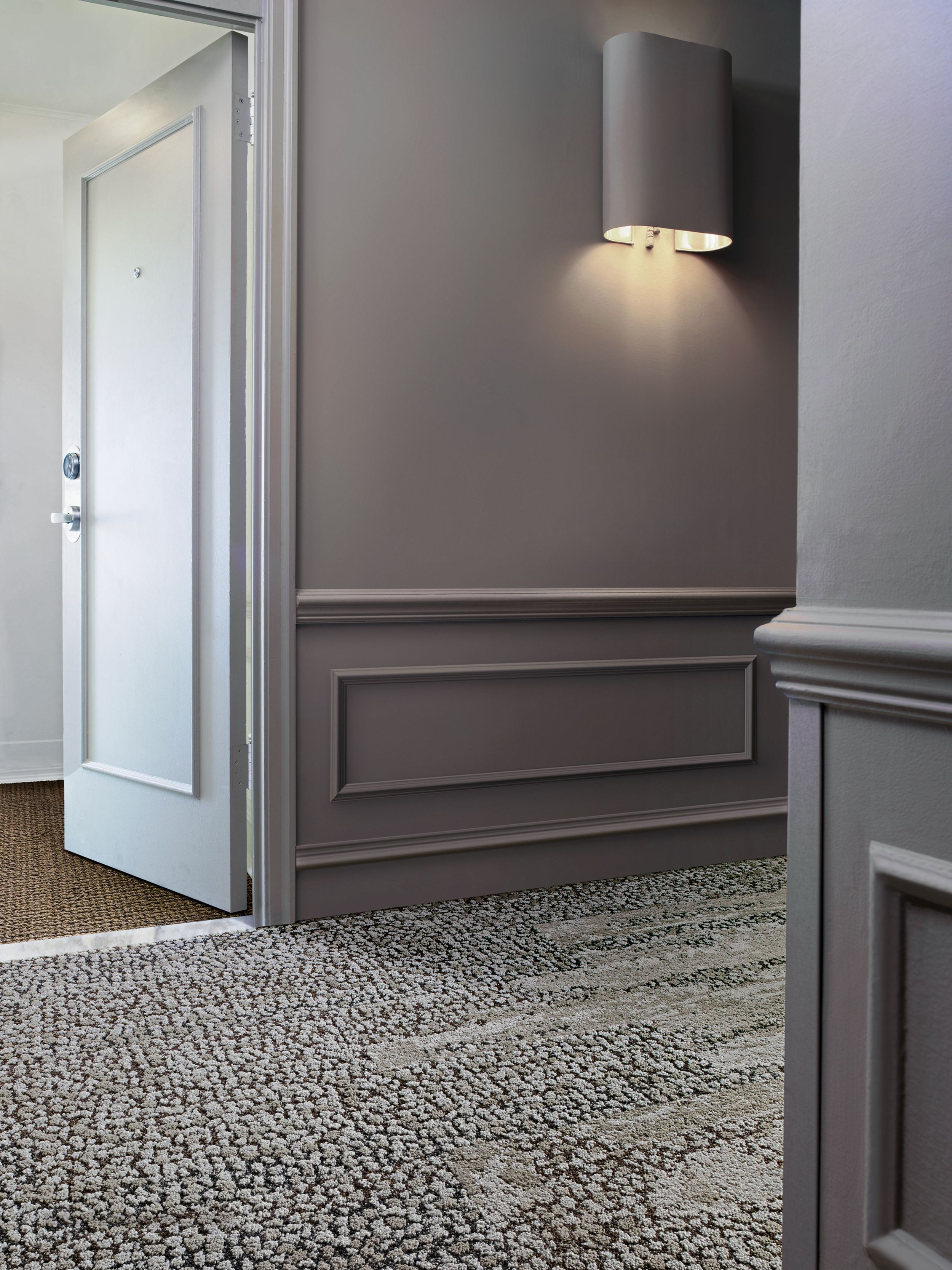 Interface HN840, HN850 and RMS 607 plank carpet tiles in hotel hallway with hotel room door ajar image number 12