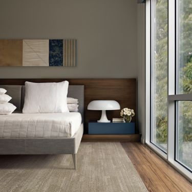 Interface RMS 704 plank carpet tile and Natural Woodgrains LVT in hotel guest room with white lamp