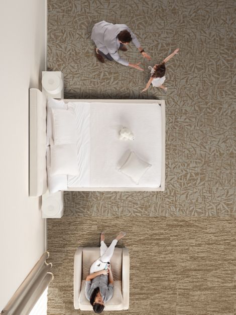 RMS 507 and RMS 508 plank carpet tile in hotel guest room with man, woman and child