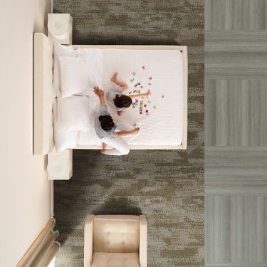 Interface RMS 704 plank carpet tile and Textured Woodgrains LVT in hotel guest room