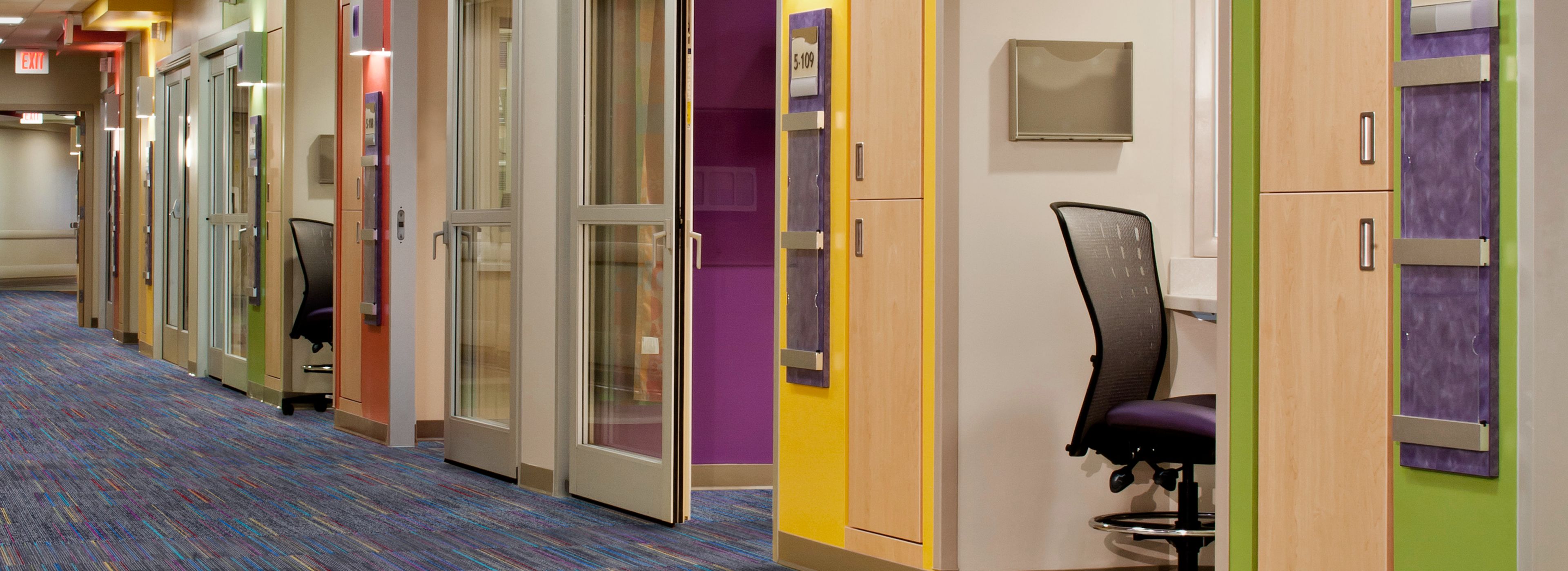 Interface Roy G Biv carpet tile in healthcare corridor with multiple rooms imagen número 1