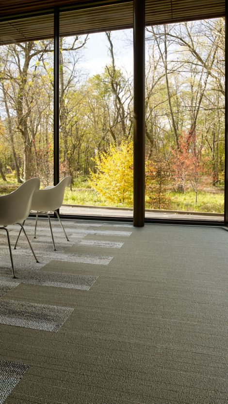Interface PH211 plank carpet tile with white chairs and forest in background imagen número 7