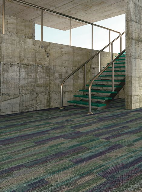 Interface Reclaim plank carpet tile in open room with stairwell