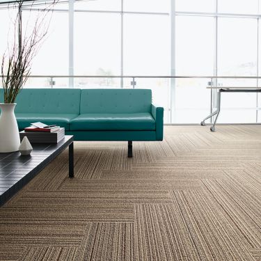 Interface SL920 plank carpet tile in seating area with green couch image number 2