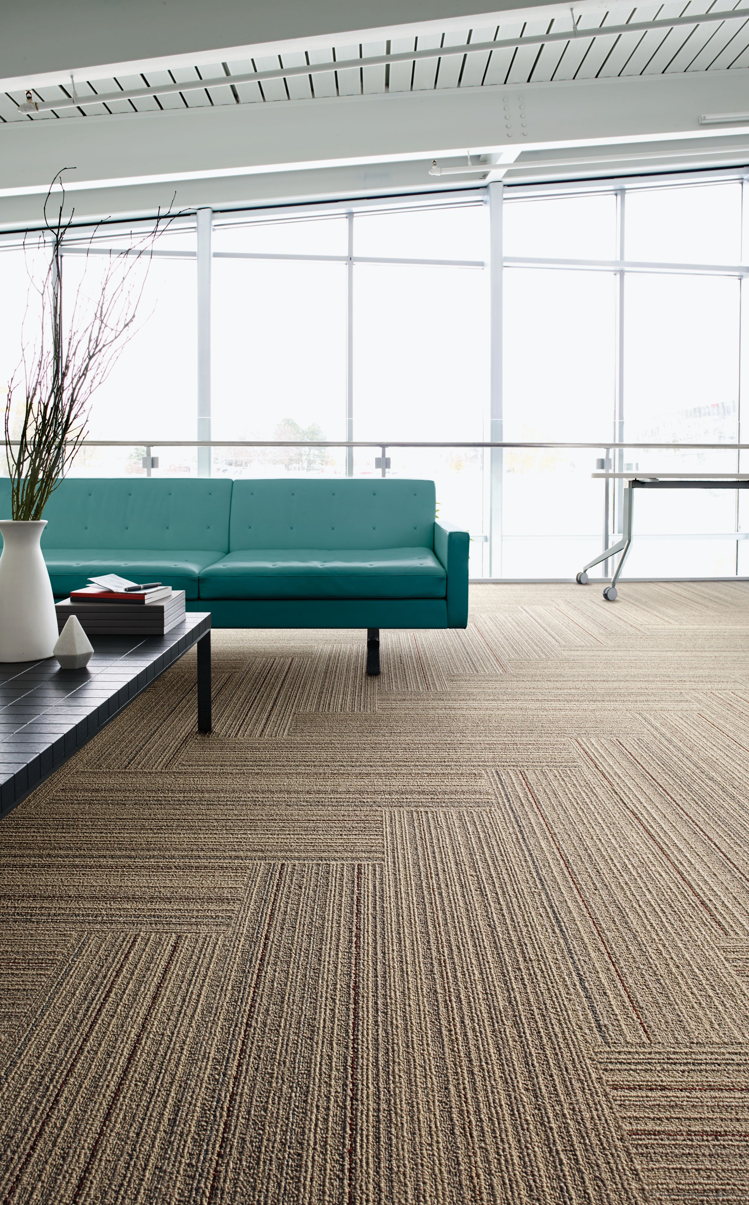 Interface SL920 plank carpet tile in seating area with green couch image number 6