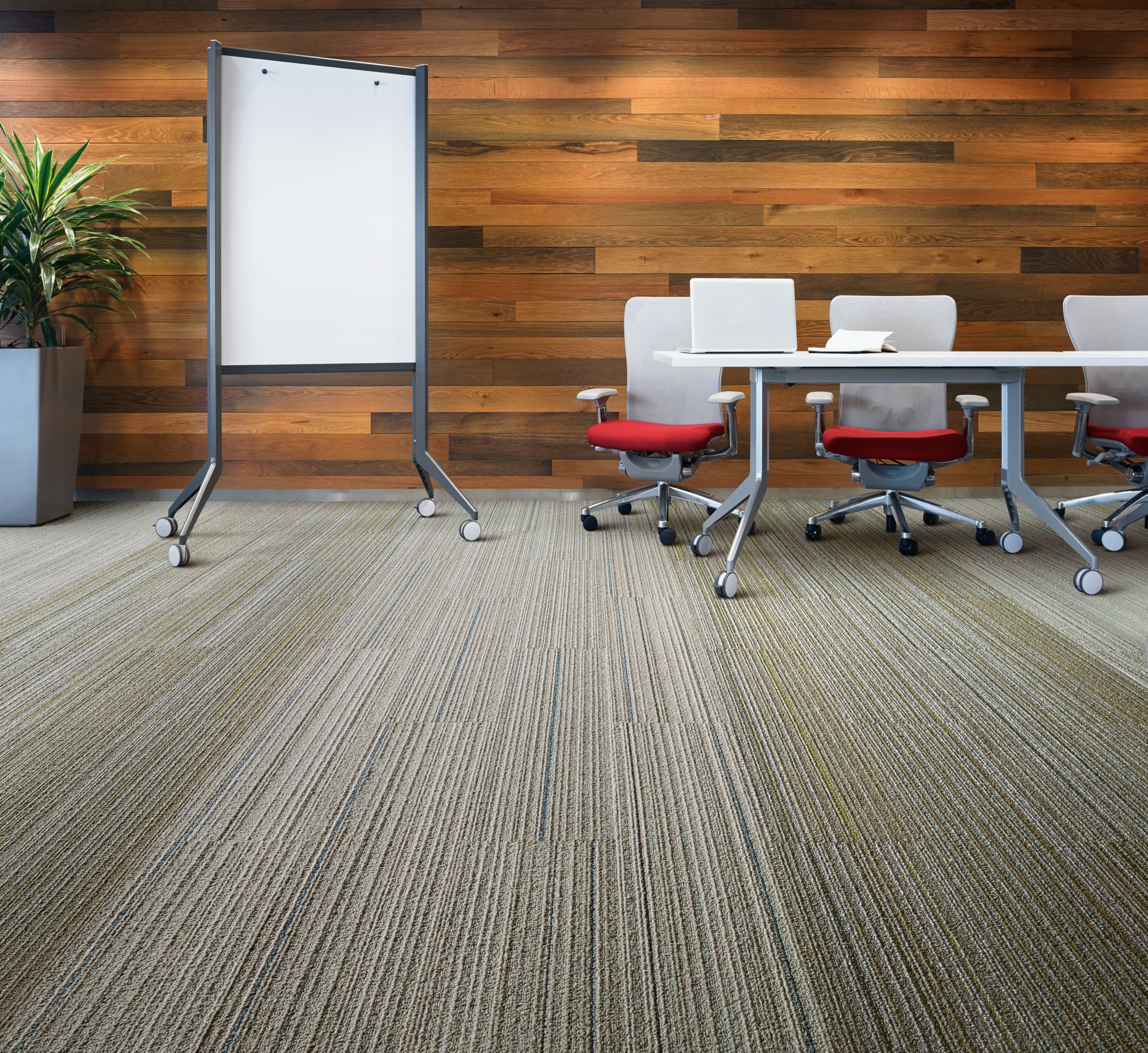 Interface SL920 plank carpet tile in meeting area with conference tables, chairs, white board and plant image number 3