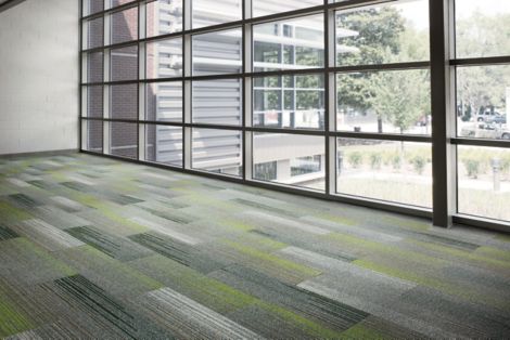 Interface SL930 plank carpet tile in common area with large windows