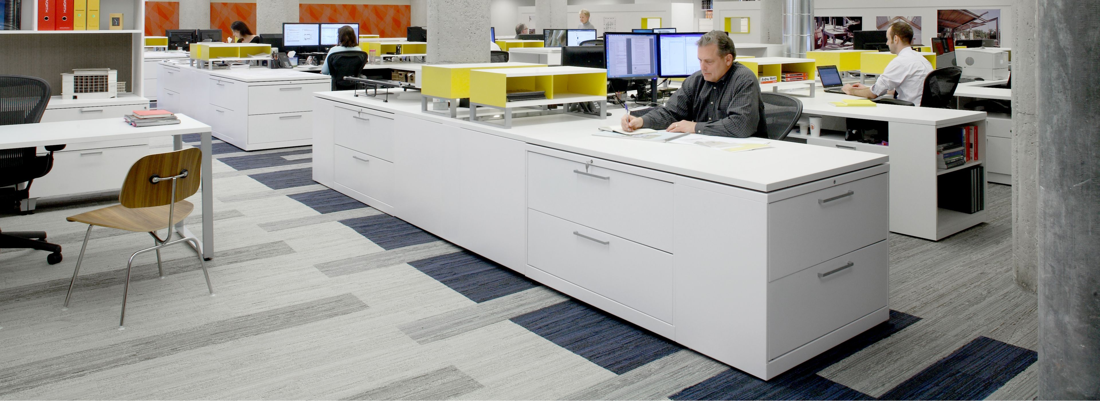 Interface Permian carpet tile in open office with men and women working at desks image number 1