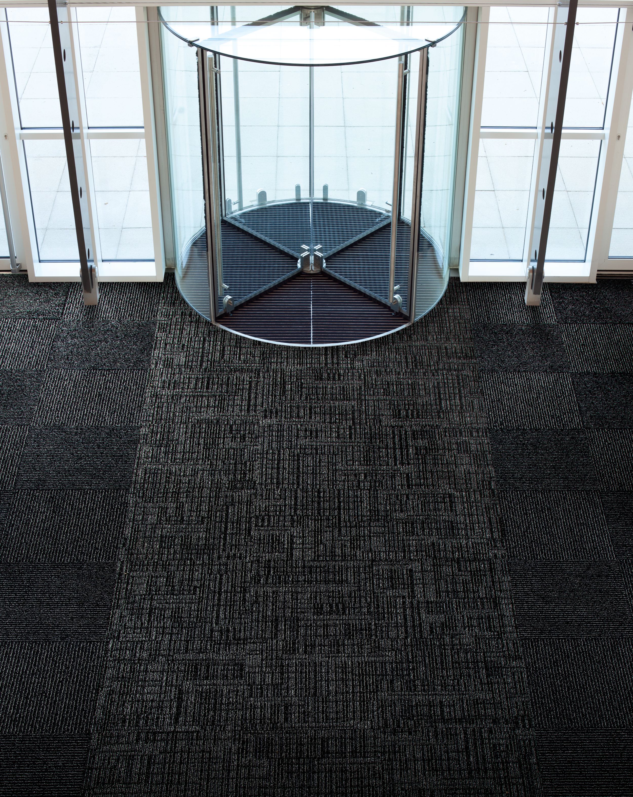 Interface SR699 and SR899 carpet tile in entryway with revolving door image number 3