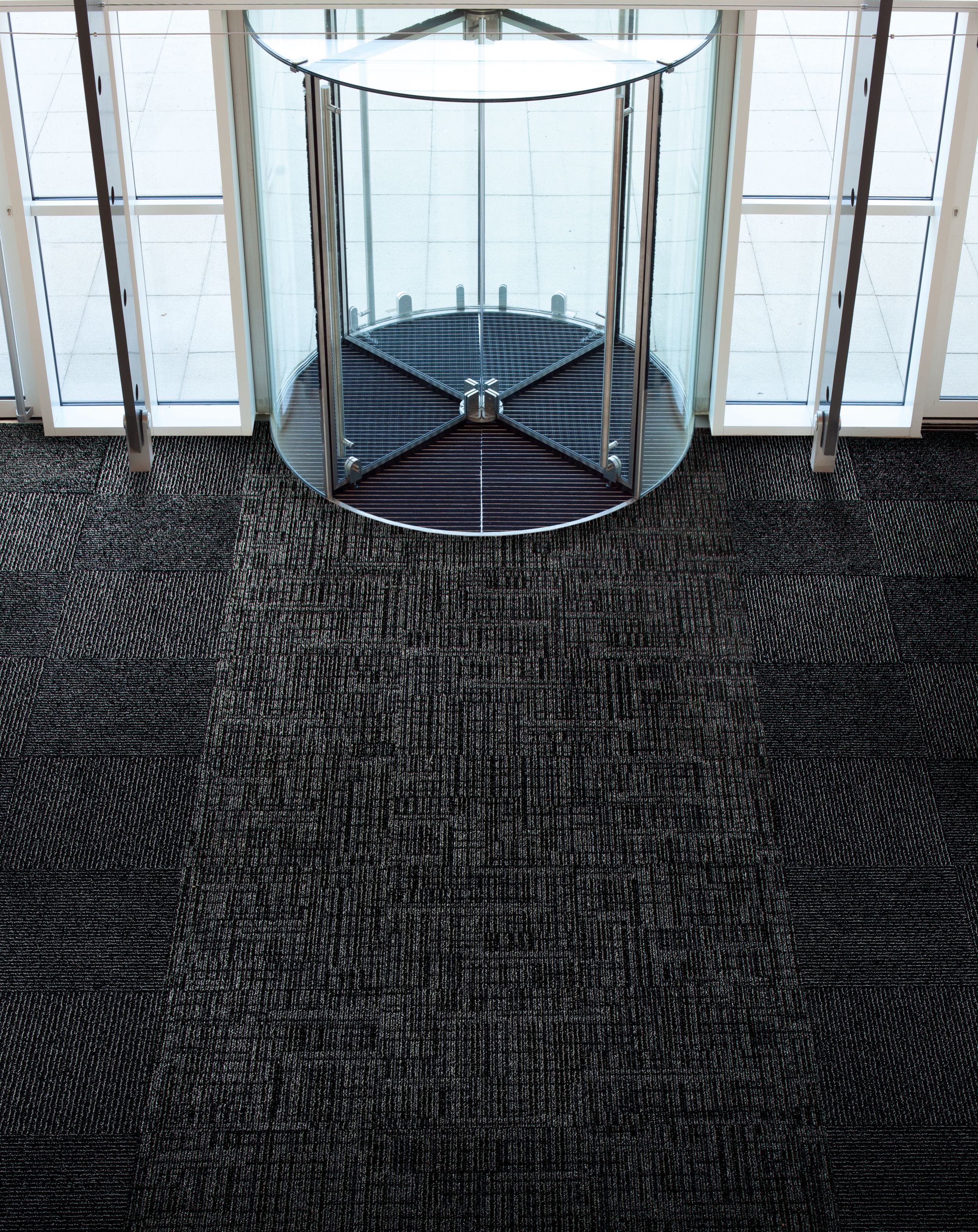 Interface SR699 and SR899 carpet tile in entryway with revolving door image number 6