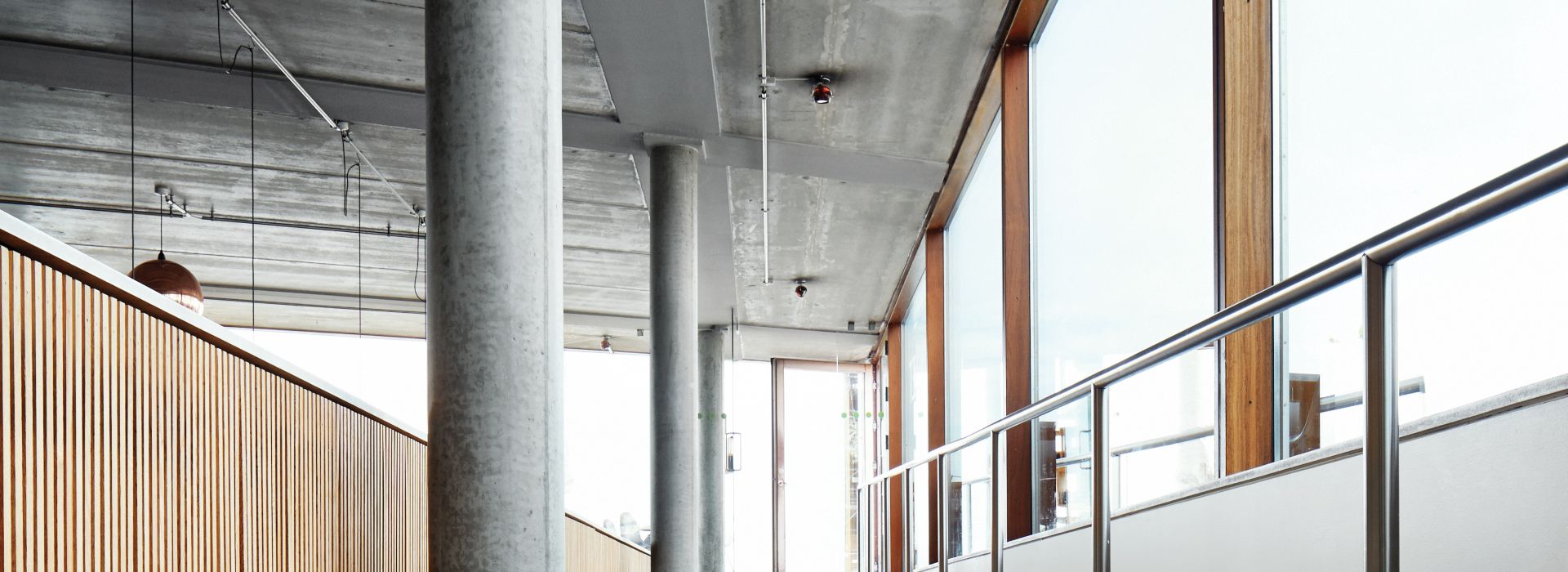 Interface SR799 carpet tile in a hallway setting with columns