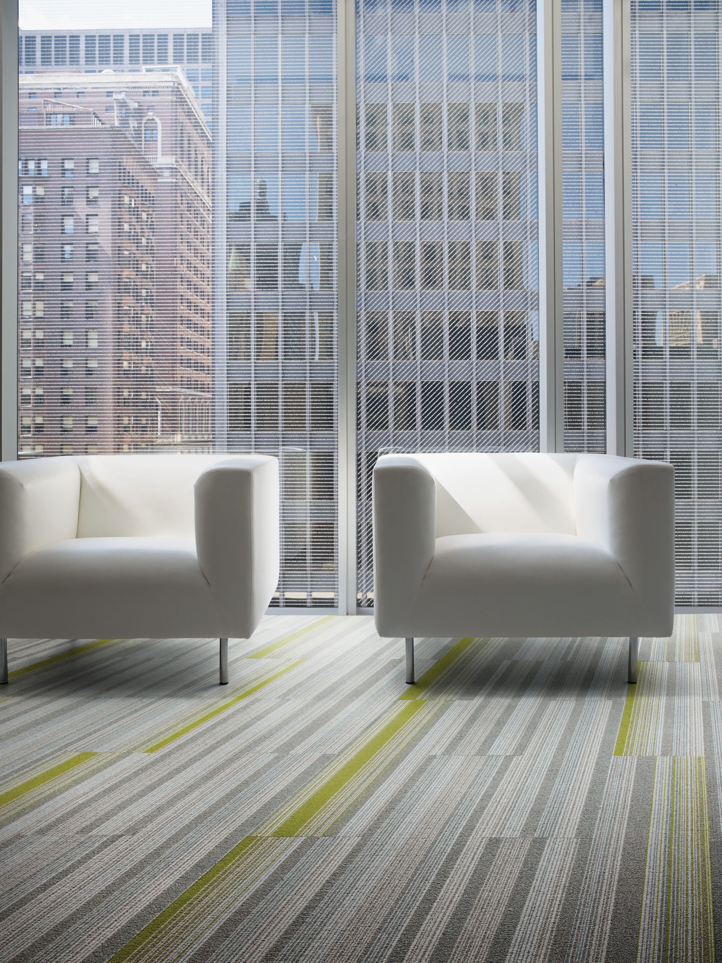 Interface SS217 and SS218 plank carpet tile in seating are with two chairs and glass walls imagen número 4