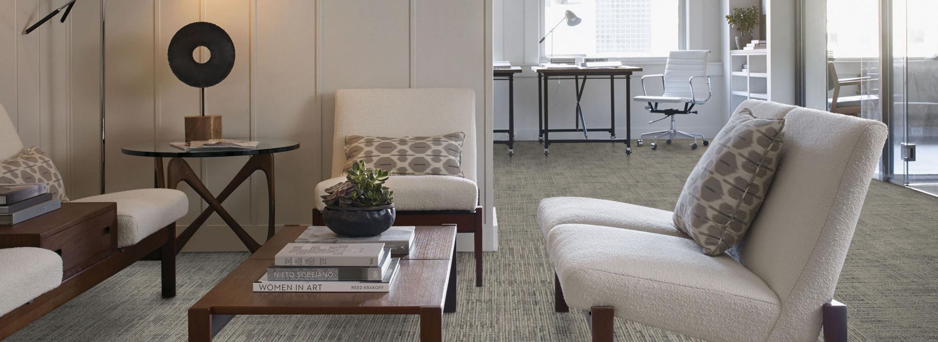 Living room with Screen Print carpet tile and white chairs