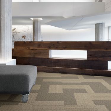 Interface ShadowBox Loop carpet tile in office common area with wooden wall and bench image number 1