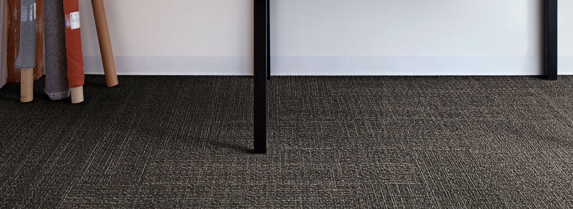 Interface Shishu Stitch and Shade plank carpet tile in workspace with table