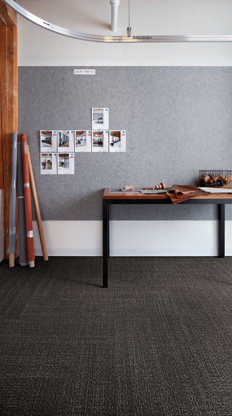 Interface Shishu Stitch and Shade plank carpet tile in workspace with table