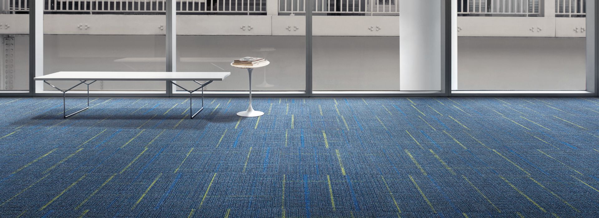 Interface Sidetrack carpet tile in lobby space with bench