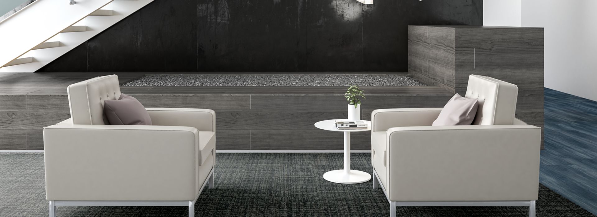 Interface Source Material plank carpet tile and Studio Set plank LVT in lobby with two white chairs and stairs