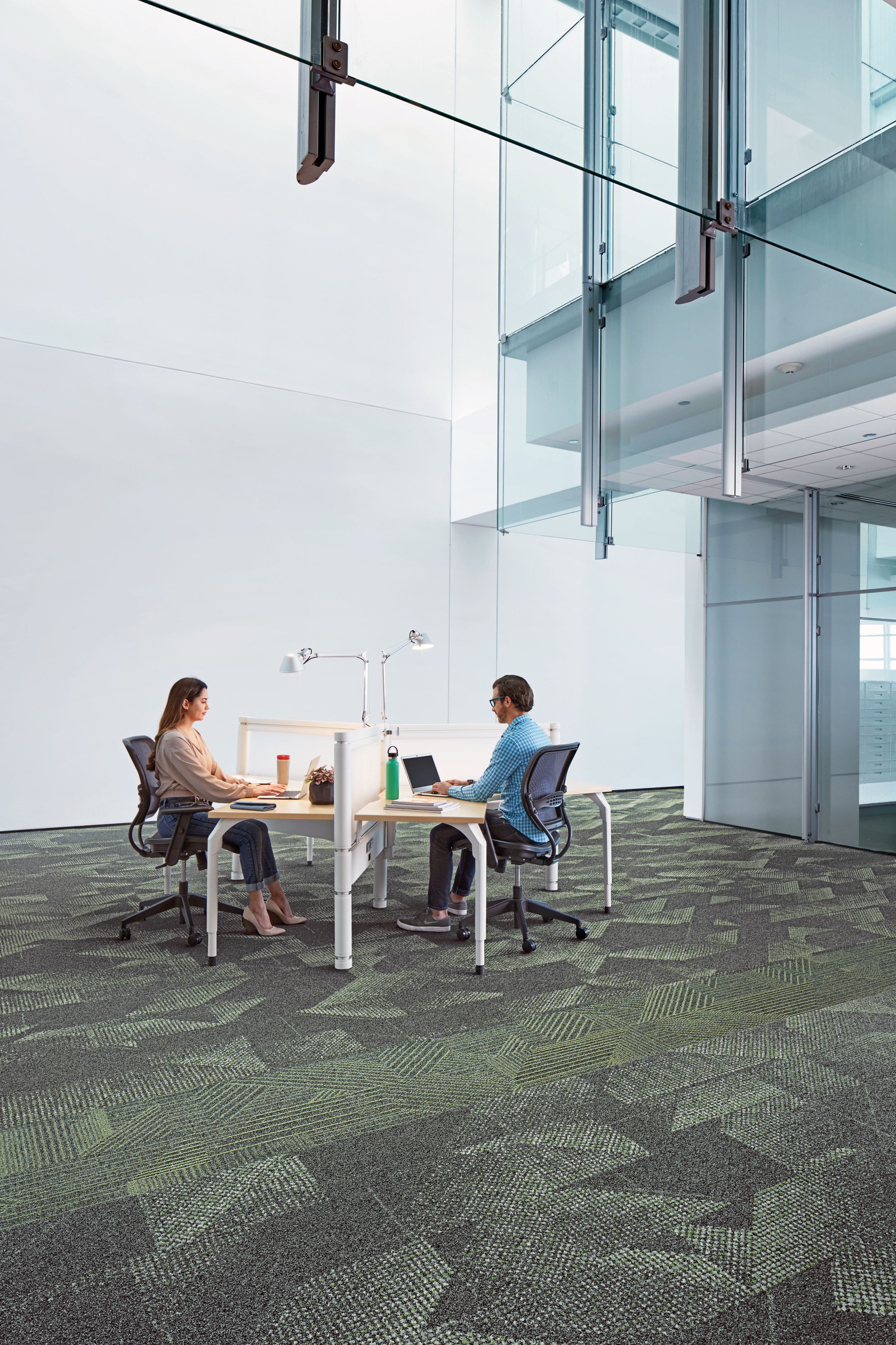 Interface Play the Angle and Spandrel plank carpet tile in office area with man and women on laptop image number 4