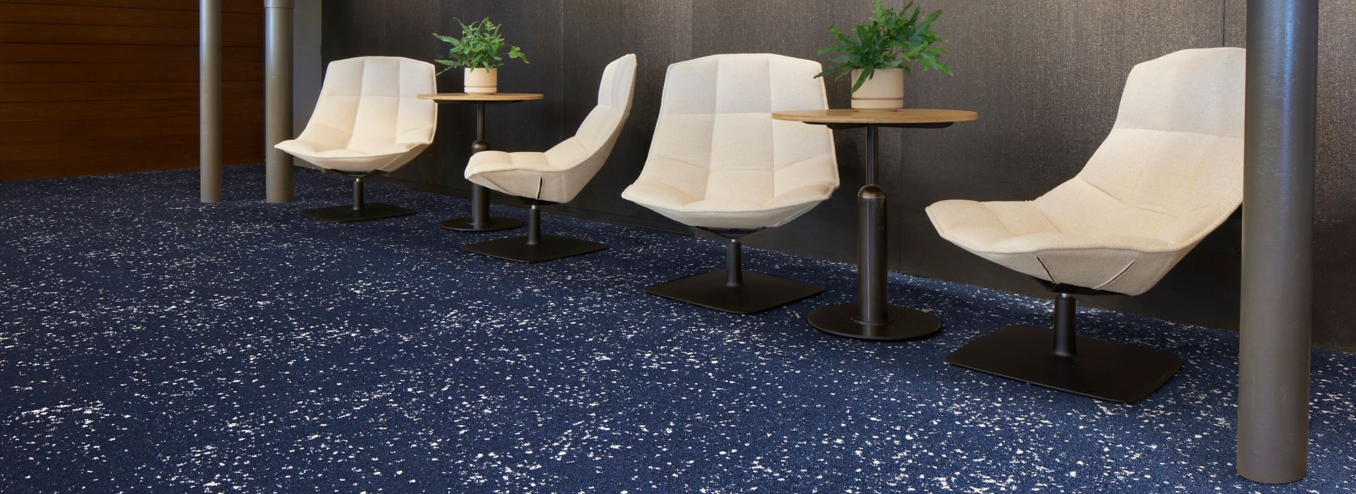 Interface Lunar Landing carpet tile in waiting area with small tables and Jehs and Laub lounge chairs