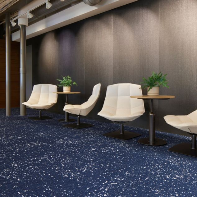 Interface Lunar Landing carpet tile in waiting area with small tables and Jehs and Laub lounge chairs