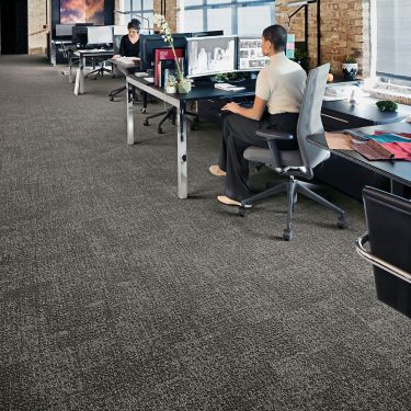 Interface Step in Time carpet tile shown with office cubicles and brick walls image number 1