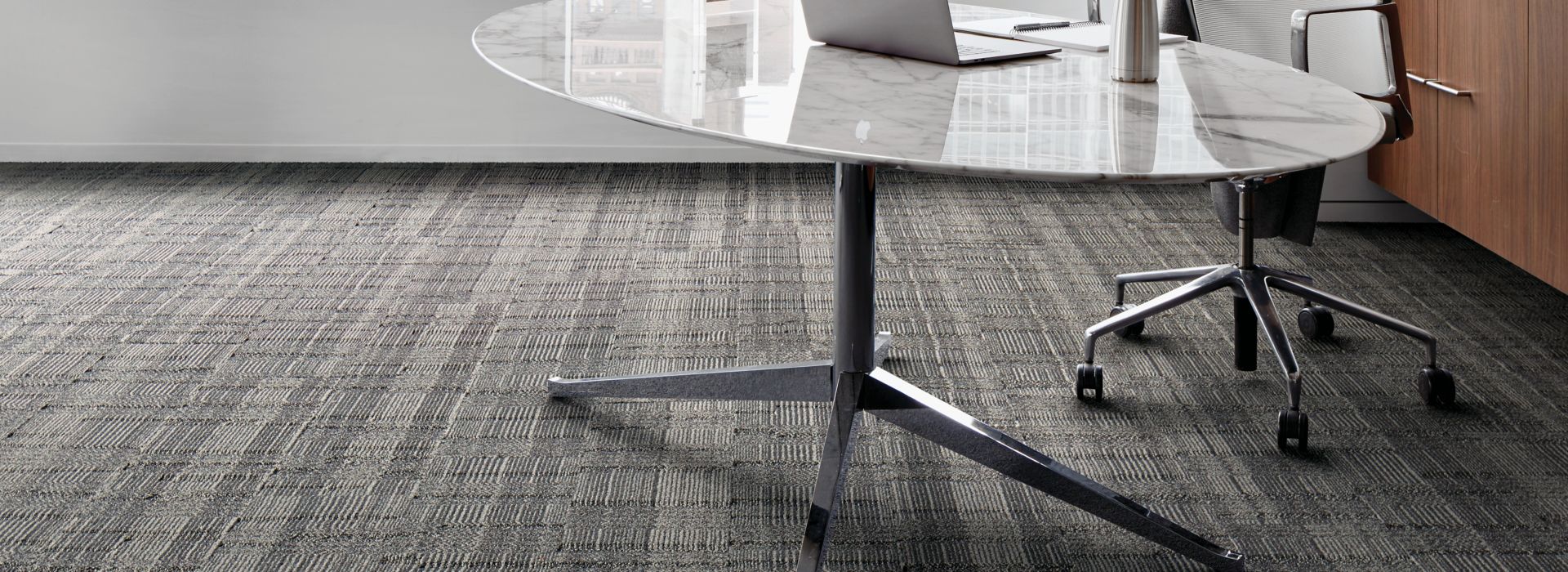 Interface Stitch Count plank carpet tile with table and chair by a window