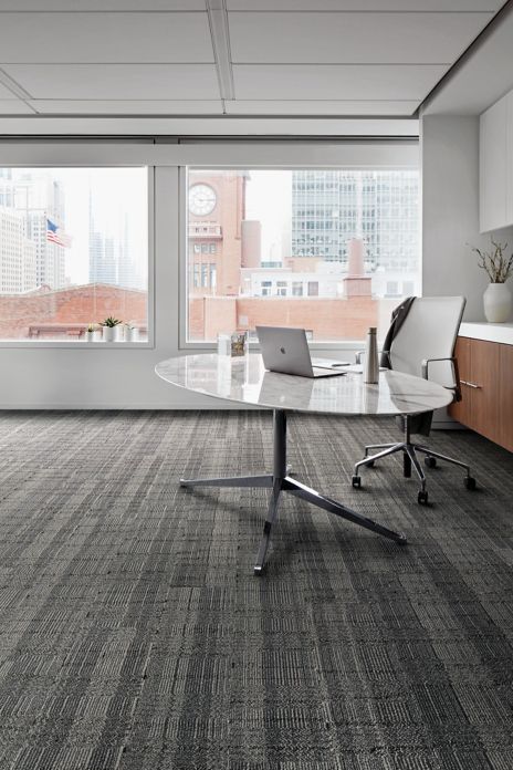 Interface Stitch Count plank carpet tile with table and chair by a window