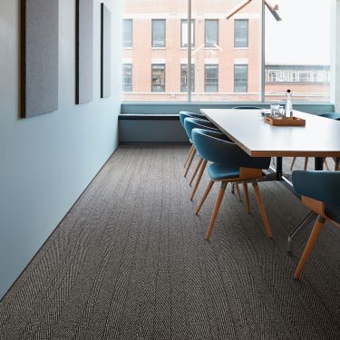 Interface Stitch in Time plank carpet tile in meeting space with wood paneling imagen número 1