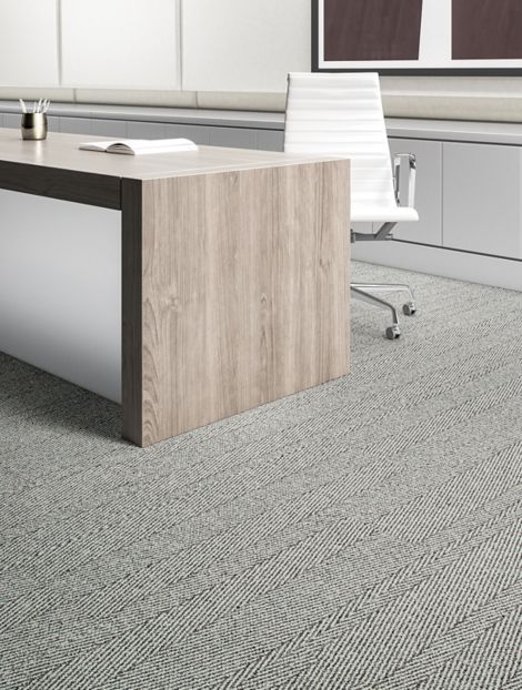 Interface Stitch in Timeplank carpet tile  in office with wood desk and chair