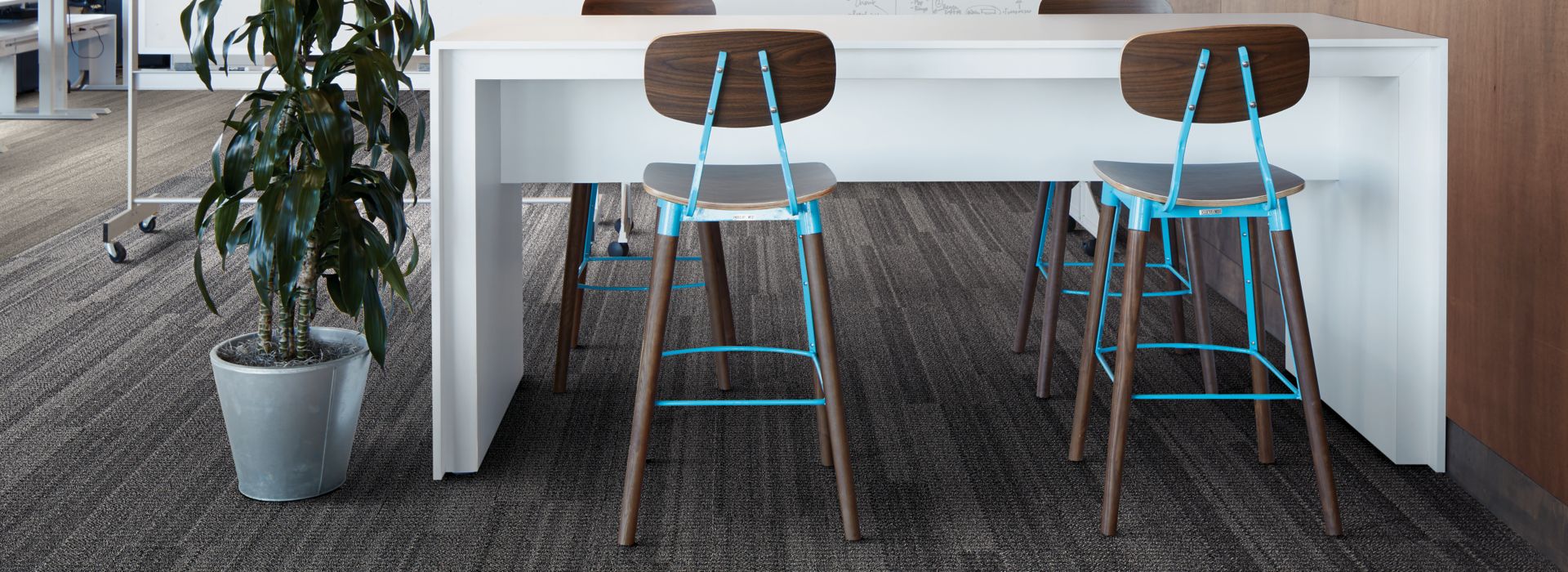 Interface Stitchery plank carpet tile seating area with high top tables and stools  image number 1