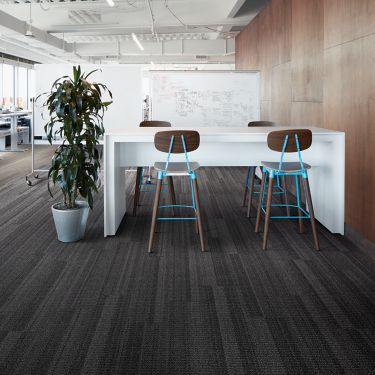 Interface Stitchery plank carpet tile seating area with high top tables and stools  image number 1