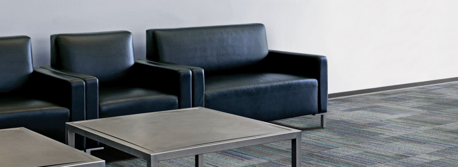 Interface Straight Edge carpet tile in waiting area with table and chairs