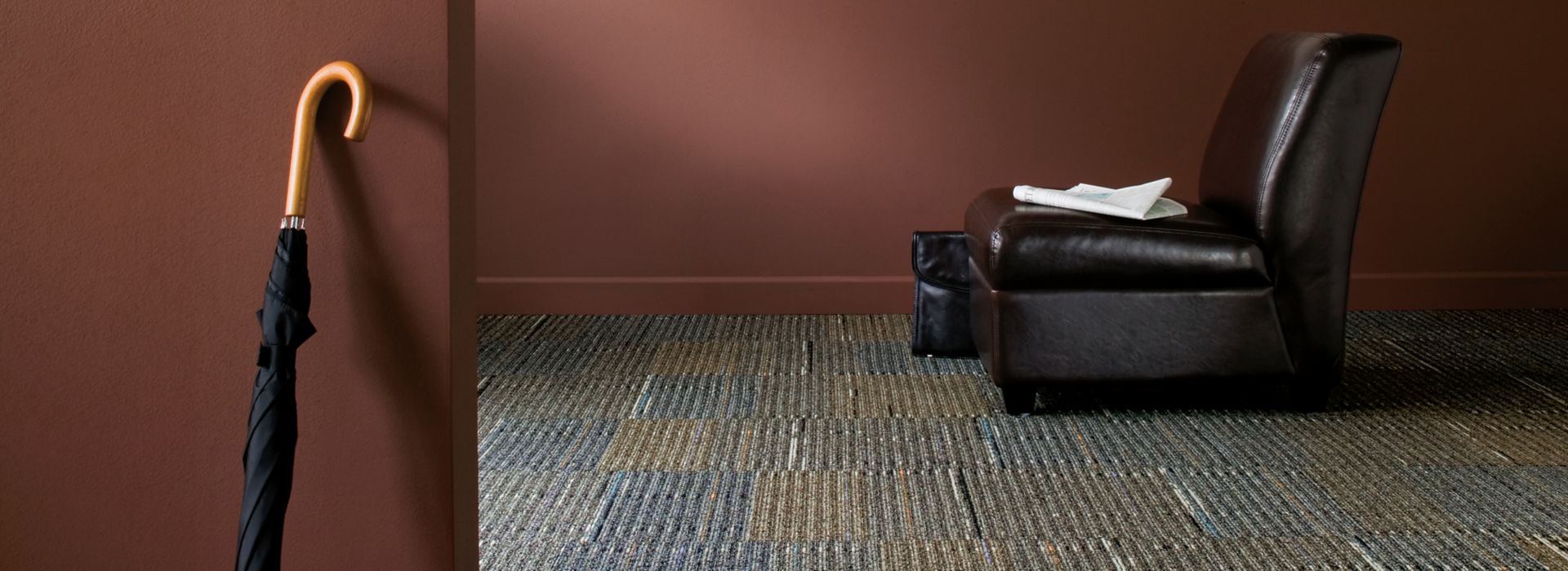 Interface Stroud II carpet tile with leather chair and umbrella