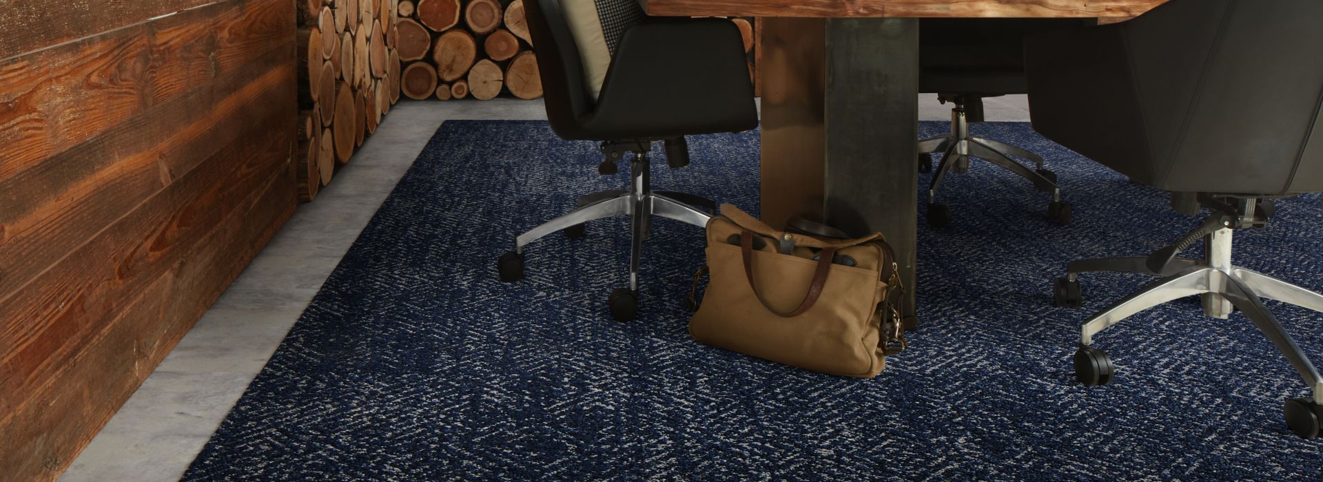 Interface Third Space 309 carpet tile with Textured Stones LVT in meeting room with wood walls and accents