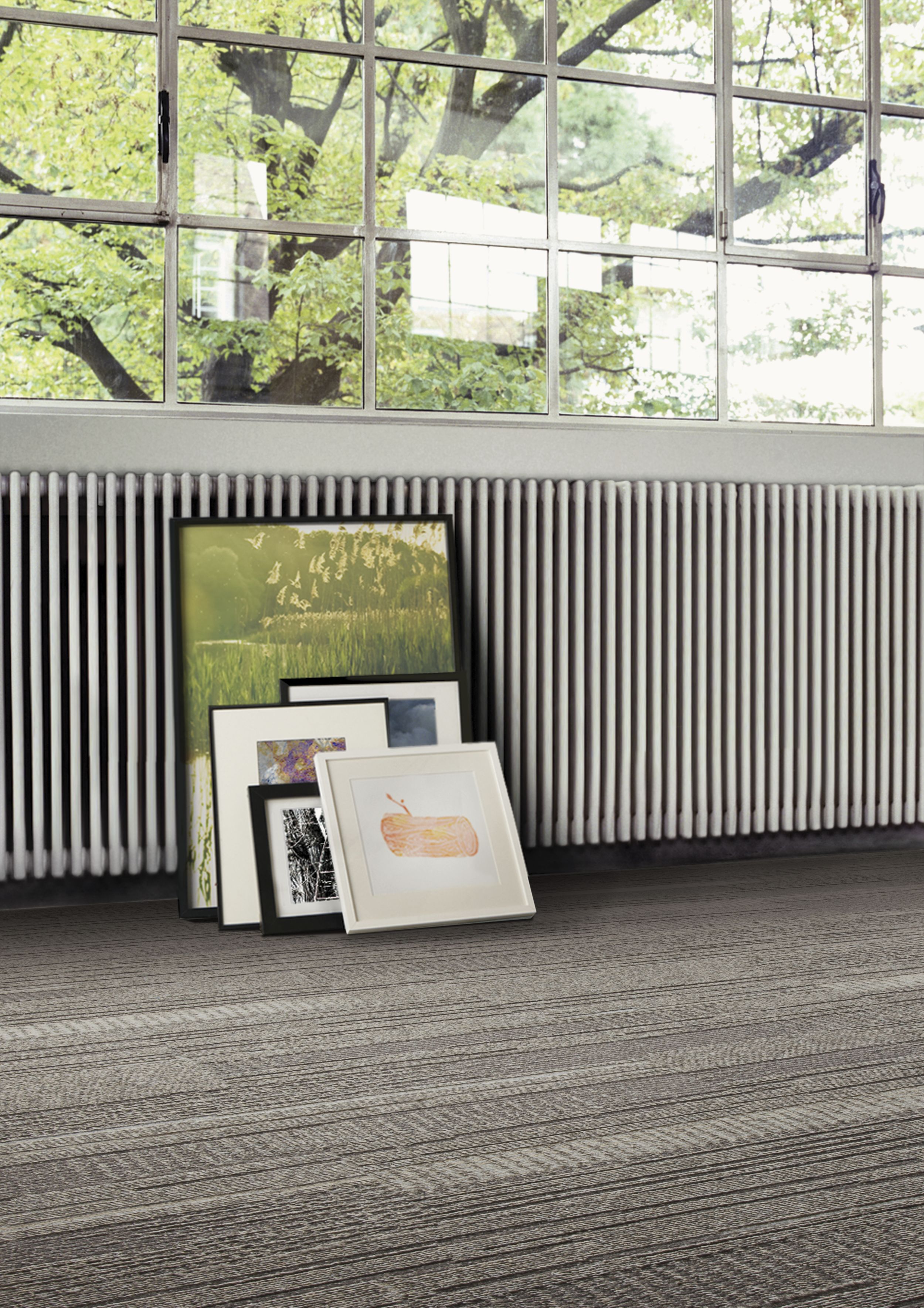 Interface Trio plank carpet tile shown with frames along the wall image number 1