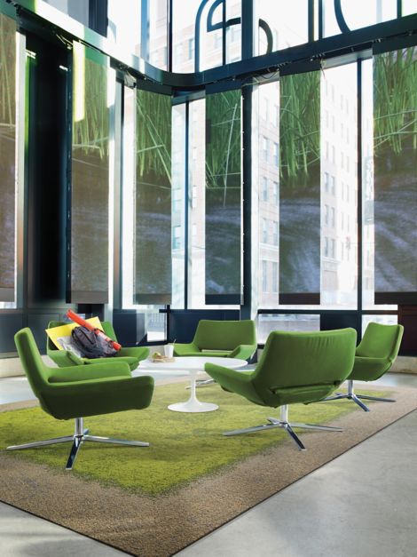 Interface UR101 and UR103 carpet tile as area rug in seating area with green chairs and white table imagen número 3