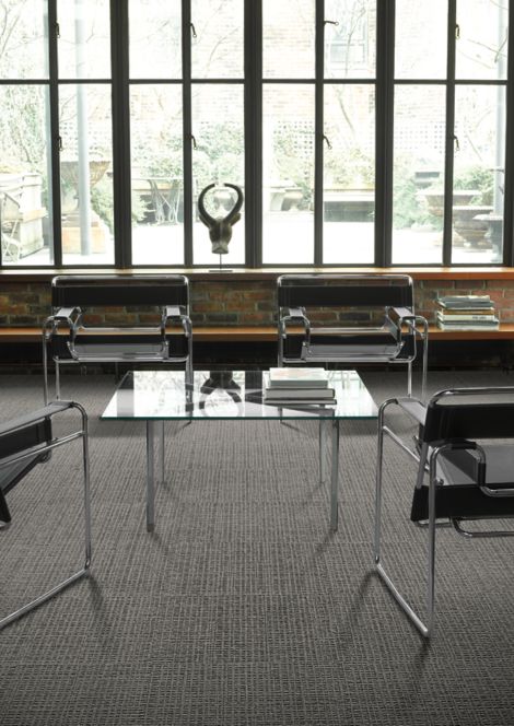 Interface UR202 carpet tile in a seating area with four chairs and table