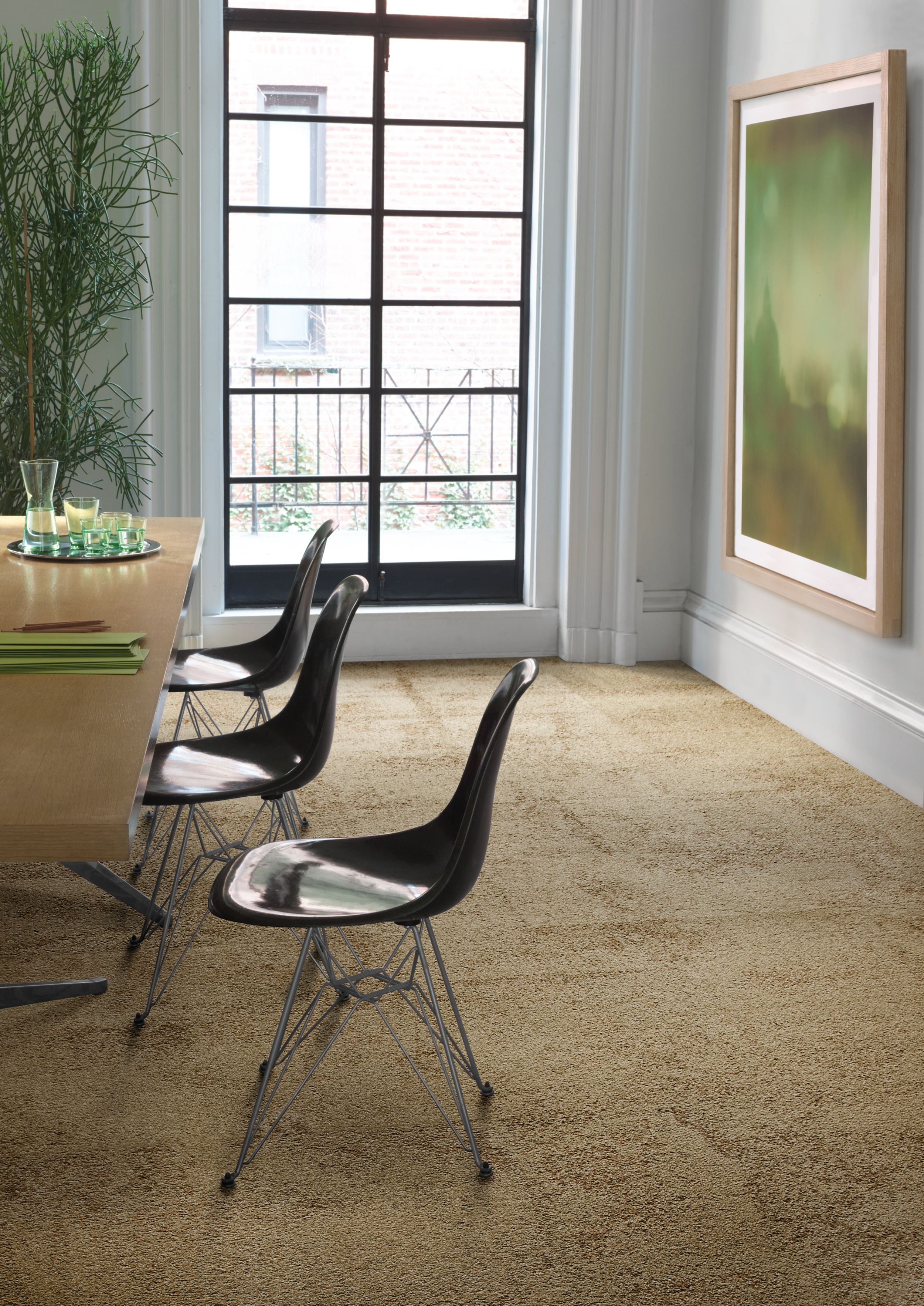 Interface UR301 carpet tile in a dining area with art and plant imagen número 5